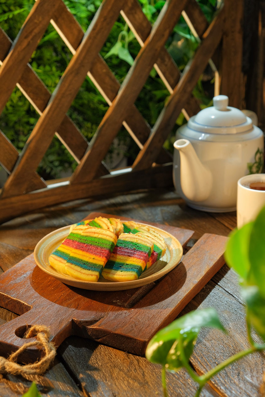 Malaysian dish Kek Lapis Sarawak or Sarawak layered cake called cheese icecream with beautiful colour over dark background. The main ingredients are butter or vegetable oil, milk and eggs.